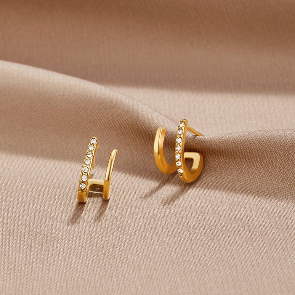Brincos de garra em ouro 18K e cristal