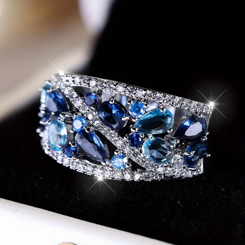 Anel Prateado Vintage com Brilho Azul
